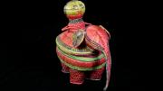 A basket designed to look like the body of an elephant with a rider perched atop